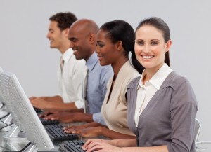 3685085-international-business-people-in-a-line-working-at-computers